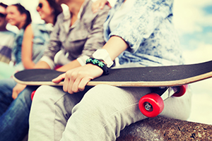 Teenager Holding Skateboard